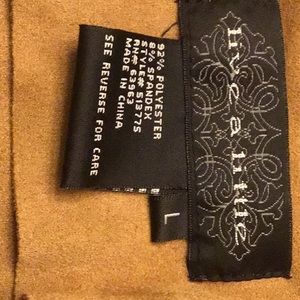 Tan faux suede western style jacket. 2 zippered pockets, can hand wash.